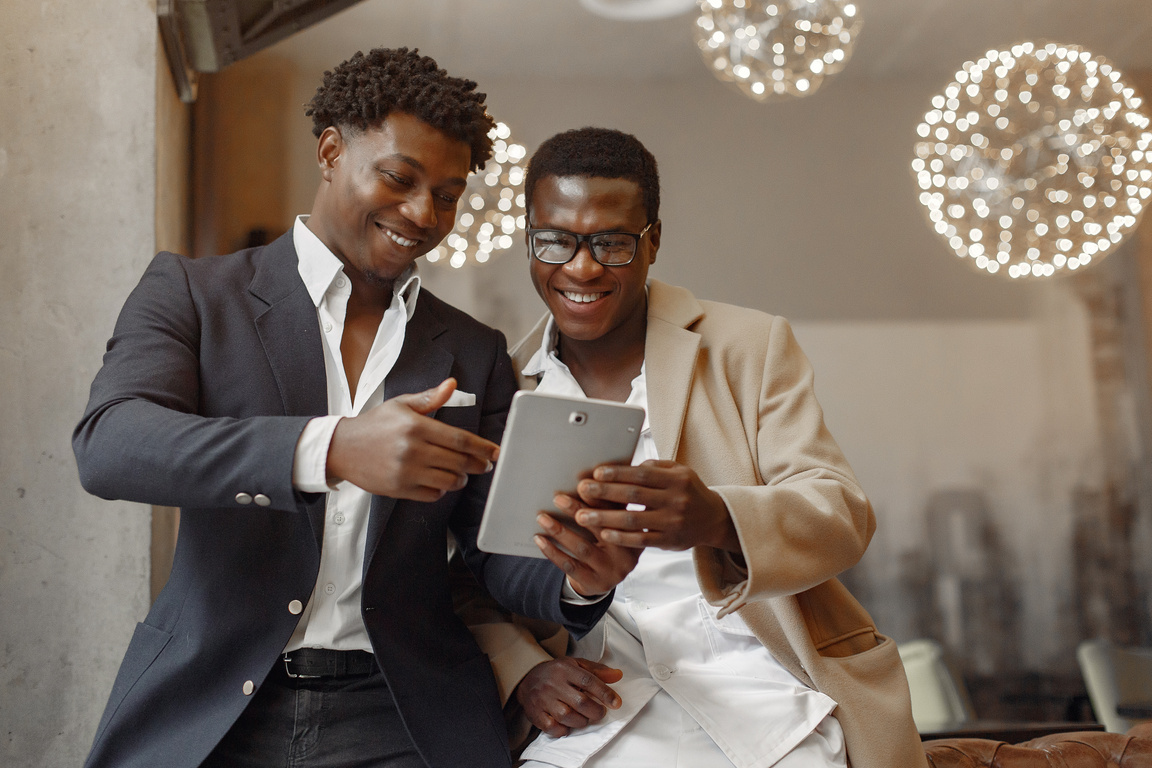 Businessmen Looking at Digital Tablet